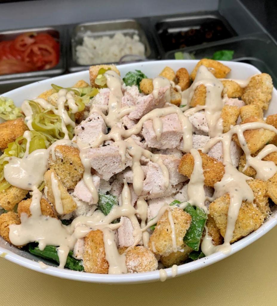 Caesar Salad · Roasted chicken breast, romaine lettuce, Parmesan cheese, croutons and Caesar dressing.