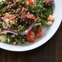 Greek Quinoa Salad · Quinoa, tomato, cucumber, red onion, kalamata olives, kale, House vinaigrette and topped wit...