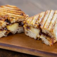 Brie & Apple Sandwich · Roasted local apples, creamy brie and fig jam.