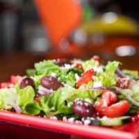 Greek Salad · Lettuce, red onions, Kalamata olives, feta, cucumber and tomatoes. 