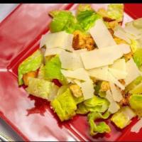 Caesar Salad · Fresh romaine lettuce, Parmesan cheese and croutons with Caesar dressing. 