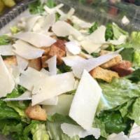 Chicken Caesar Salad · Chicken strips with fresh romaine lettuce, Parmesan cheese and croutons with Caesar dressing.
