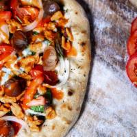 Buffalo 66 Pizza · Garlic, olive oil base, vegan Buffalo chicken, tomato, onion, spinach, vegan cheese.