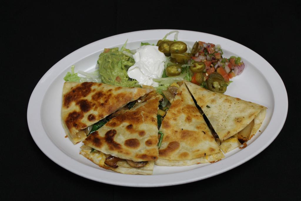 Quesadilla · Large flour tortilla with meat and a mixture of grated cheeses served with a side of pico de gallo, sour cream, guacamole, lettuce, and jalapenos.
