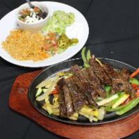 Beef Fajita Platter · Served with rice, charro beans, sour cream, pico de gallo, guacamole, and tortillas.