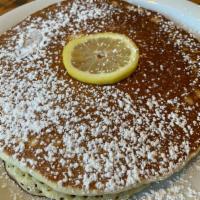 the lemon ricotta pancake stack · stack of 3 house-made lemon ricotta pancakes | powdered sugar | whipped butter + syrup