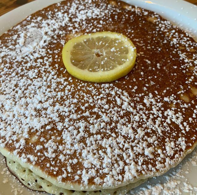 the lemon ricotta pancake stack · stack of 3 house-made lemon ricotta pancakes | powdered sugar | whipped butter + syrup