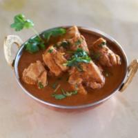 Curry · A classic Indian curry with tomatoes, onions, and authentic spices. Comes with choice of bas...