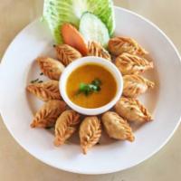 Vegetable Momos · Authentic Nepalese dumplings. Steamed or fried. Served with himchuli sauce.