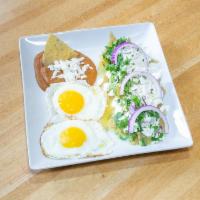 Chilaquiles Rojos · Fried tortilla chips bathed in our red chipotle salsa, topped with Mexican sour cream, queso...