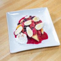 Fruit Topped French Toast · French toast topped with strawberries, blueberry compote, bananas, drizzled with powdered su...
