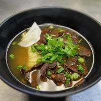 31. Beef Noodle Soup in Clear Broth · In clear broth (beef only), spinach, cilantro, bok choy, green onion, radish and sliced beef.