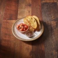 Bruschetta Vegan · Roma tomatoes, onions, fresh basil with toasted ciabatta bread and olive tapenade. Vegetarian.