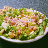 Chef’s Salad · Fresh tossed salad with ham, cheese, hard cooked egg, garnished with croutons and crackers w...