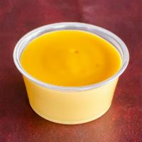 Cup of Cheese Sauce · Our signature nacho cheese dipping sauce