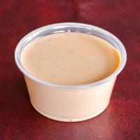 Cup of Sriracha Ranch Sauce · Our classic ranch with a hint of spicy sriracha
