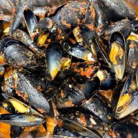 Mussels in Red or Garlic Sauce · Mussels cooked in a red or garlic sauce.