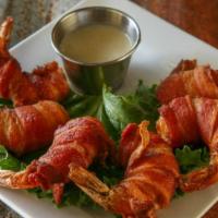 Bacon Wrapped Prawn Appetizer · 6 large prawns wrapped with hickory smoked bacon. Quick fried and served with a jalapeno mayo.