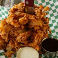Onion Ring Loaf · Sweet onions thinly sliced and hand battered. Served with BBQ and ranch dressing.
