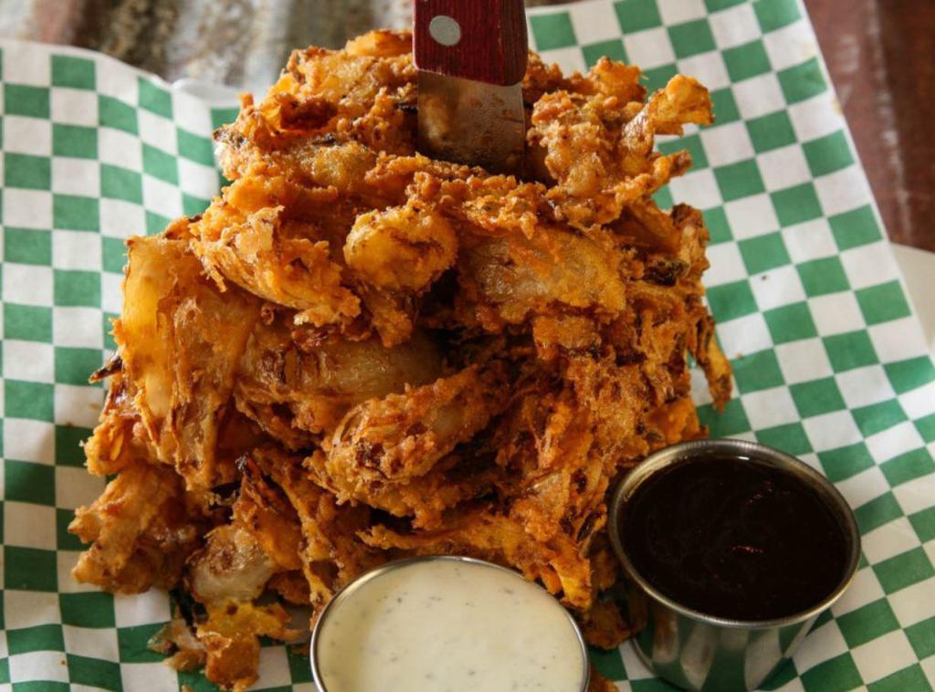 Onion Ring Loaf · Sweet onions thinly sliced and hand battered. Served with BBQ and ranch dressing.