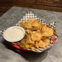 Homemade Potato Chips · Accompanied with a sour cream and green onion dip.