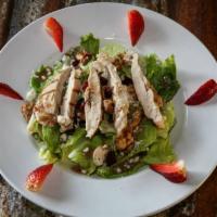 California Chicken Salad · Fire grilled chicken, bleu cheese crumbles, sugared walnuts, fresh strawberries and dried cr...