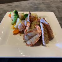 Fire Roasted Jumbo Shrimp · 6 U-15 Jumbo shrimp are fire roasted in their split shell and basted with garlic butter. Ser...