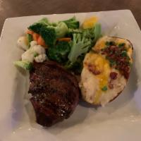 Top Sirloin Steak · Served with vegetables and choice of side.