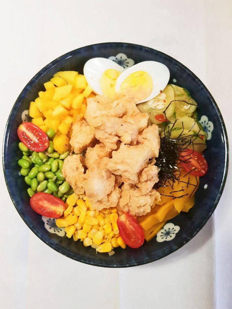 P11. Popcorn Chicken Bowl · Includes kimchi cucumber, egg, oshinko, sweet corn, edamame, cherry tomato, roasted seaweed.