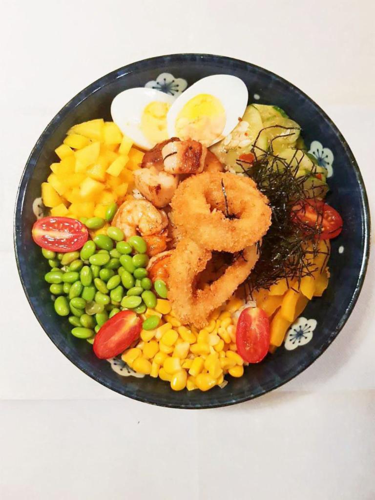 P16. Seafood Bowl · Include kimchi cucumber, egg, oshinko, sweet corn, edamame, cherry tomato, roasted seaweed.