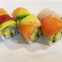 S4. Rainbow Roll · Crabmeat, avocado, cucumber topped with mixed fish. Raw.
