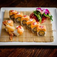 S4. Golden Dragon Roll · Shrimp tempura, mango, topped with lobster crunchy, tobiko and house special sauce. Spicy.