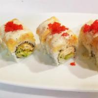 S21. Lobster Kings Roll · Salmon tempura, avocado, cucumber topped with spicy crunchy lobster, and eel sauce. Spicy.