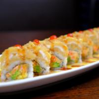 Brooklyn Roll · Spicy kanni, avo,crunch, topped with wite fish served with homemade hot sauce , eel and mang...