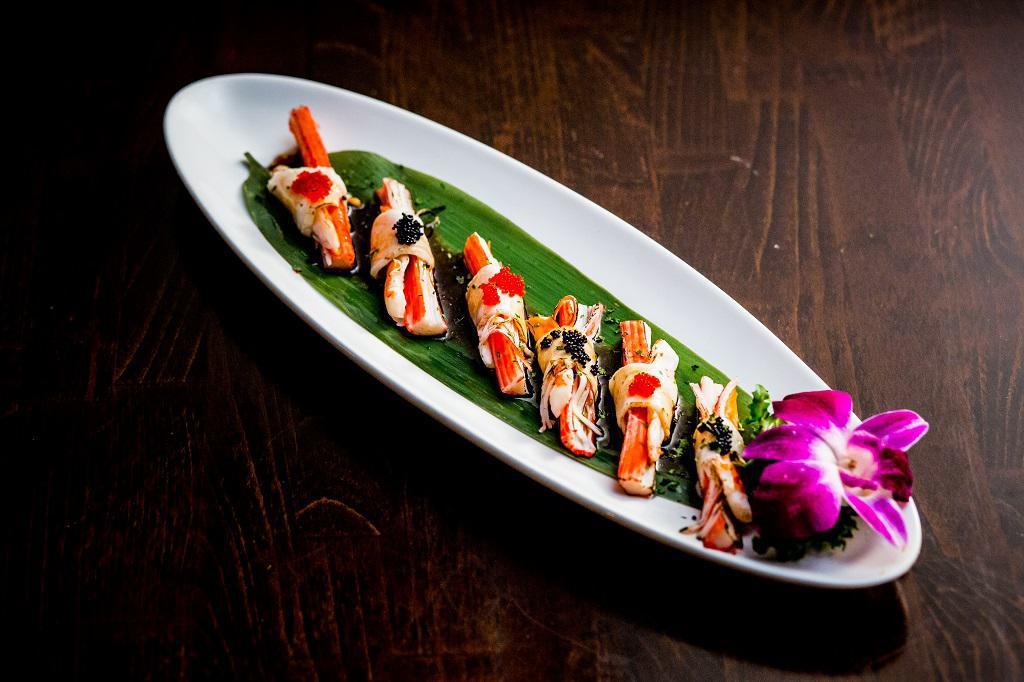 U5. Akimomo · Crabmeat and shrimp wrapped in torched white tuna with tobiko and yuzu sauce. Raw.