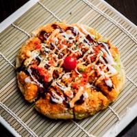 Sushi Pizza · Pancake, spicy crunchy tuna, spicy crunchy salmon, scallion, masago with chef special sauce....