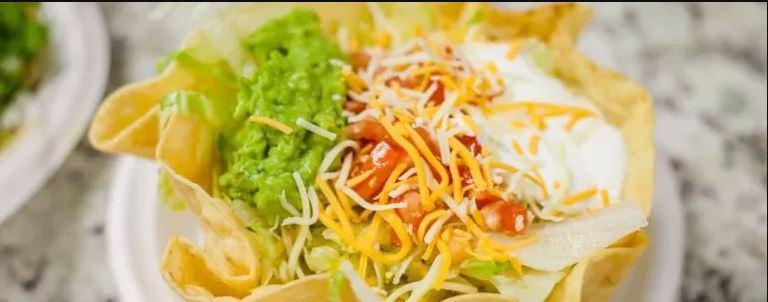 Chicken Taco Salad · Served with rice, lettuce, tomato, guacamole, sour cream, and cheese. Taco filling mixed with vegetables.