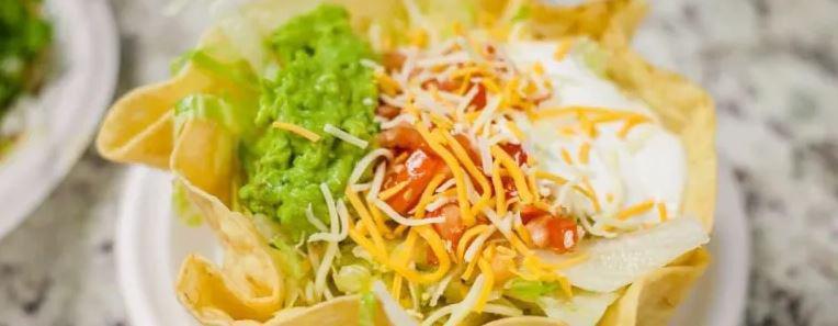 Shrimp Taco Salad · Includes Oscar's secret sauce. Served with rice, lettuce, tomato, guacamole, and cheese. Taco filling mixed with vegetables.