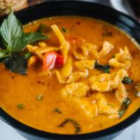 17. Red Curry · Creamy red curry with Thai basil, peas, bamboo, & bell peppers. Served with jasmine rice.