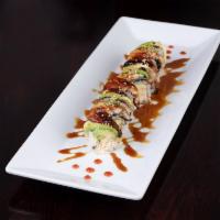 Dinosaur Roll · Shrimp tempura, crab salad topped with eel avocado and eel sauce. Cooked.