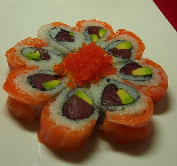 Paul Blossom Roll · Tuna, avocado topped with salmon with tobiko.