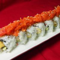 Shrimp Tempura DLX Roll · Shrimp tempura, crab meat, and cucumber topped with spicy tuna and joy special sauce on the ...