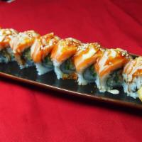 Island Roll · Shrimp tempura, real crab meat, and cucumber topped with salmon, sliced lemon, tobiko with J...