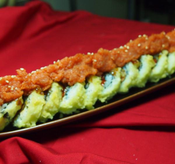 Volcano Roll · Deep fried spicy tuna topped with spicy tuna and joy special sauce. Spicy.