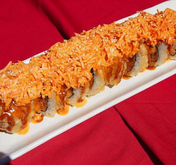 Monster Roll · Deep fried spicy tuna, unagi, cream cheese topped with spicy crab meat and spicy sauce. Spicy. Cooked.