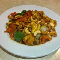F8. Cashew · Zucchini, carrots, mushrooms, green and red pepper, and white onion with cashew nuts in brow...