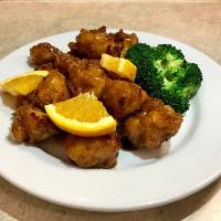 P1. Orange Chicken · Crunchy chicken with orange peel and hot peppers in sweet and spicy sauce, served with steam...