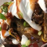 Loaded Baked Potato · Shredded cheddar cheese, bacon, sour cream, house spicy BBQ sauce and chives. Choice of pull...