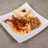 Huevos Rancheros Breakfast · 2 eggs, fried or scrambled, topped with ranchera sauce. Served with beans, potatoes and bacon.