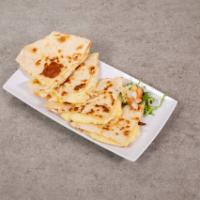 Quesadilla · Flour or corn tortilla with melted cheese. Served with sour cream, lettuce and pico de gallo.